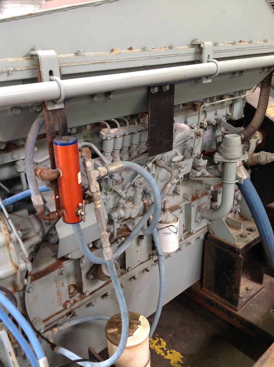 Before: Barge pump engine inside enclosed unit 